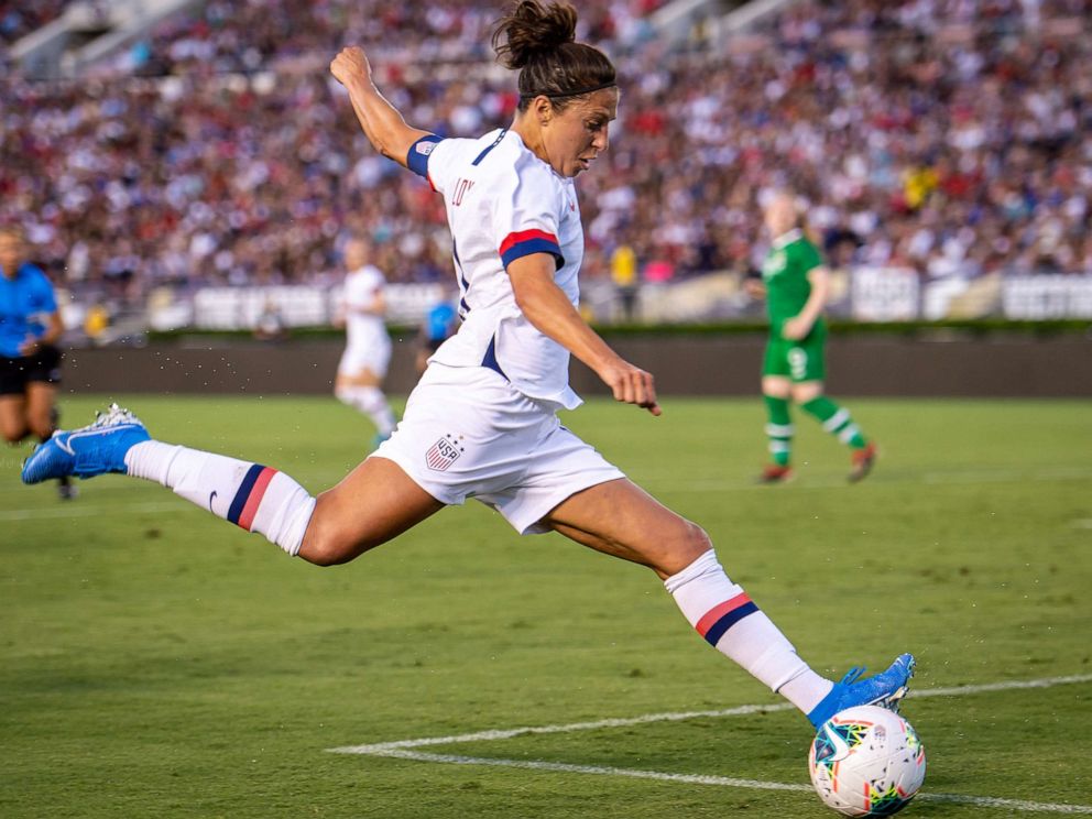 A soccer player striking the ball during a match