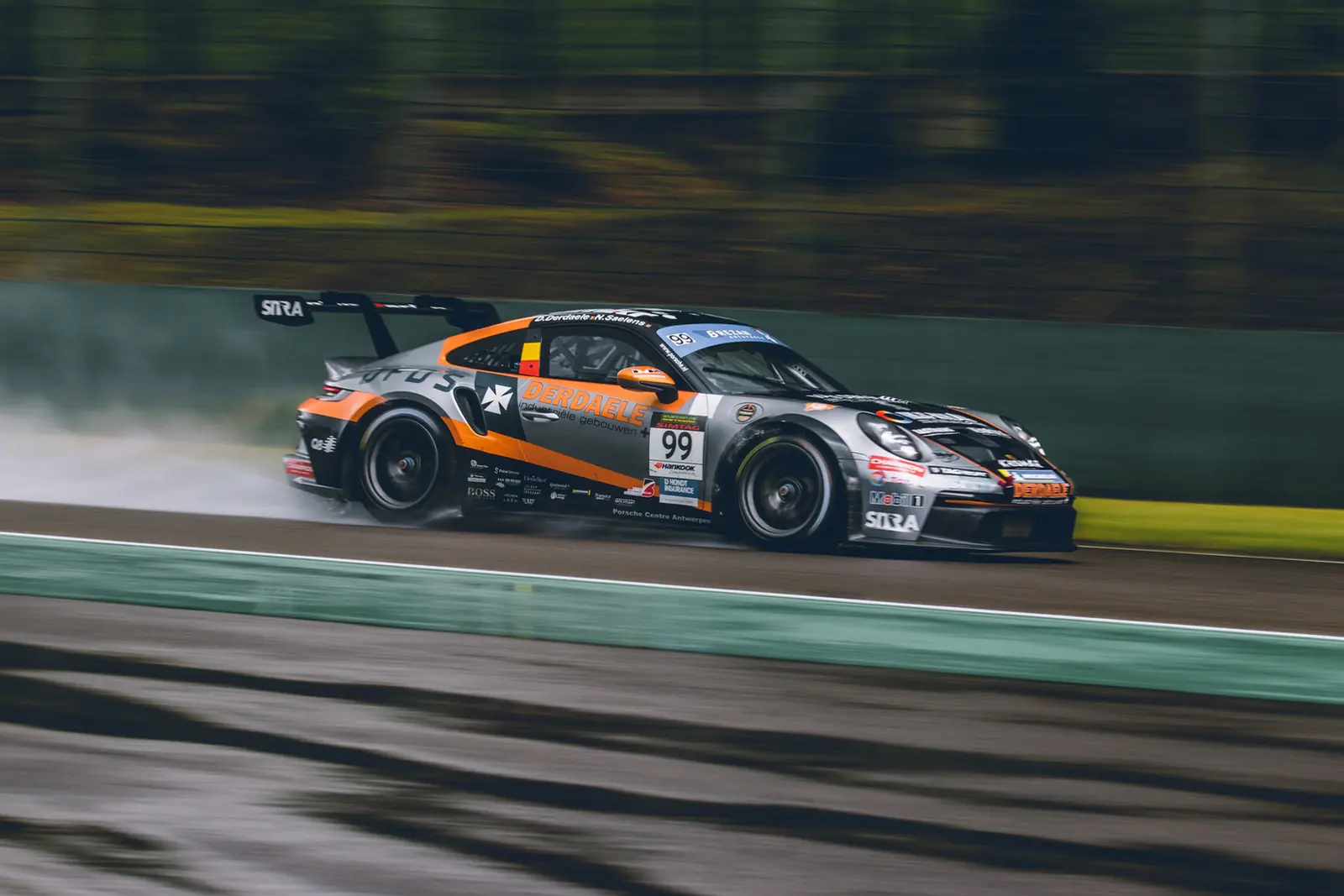 A race car speeding along a motorsport track